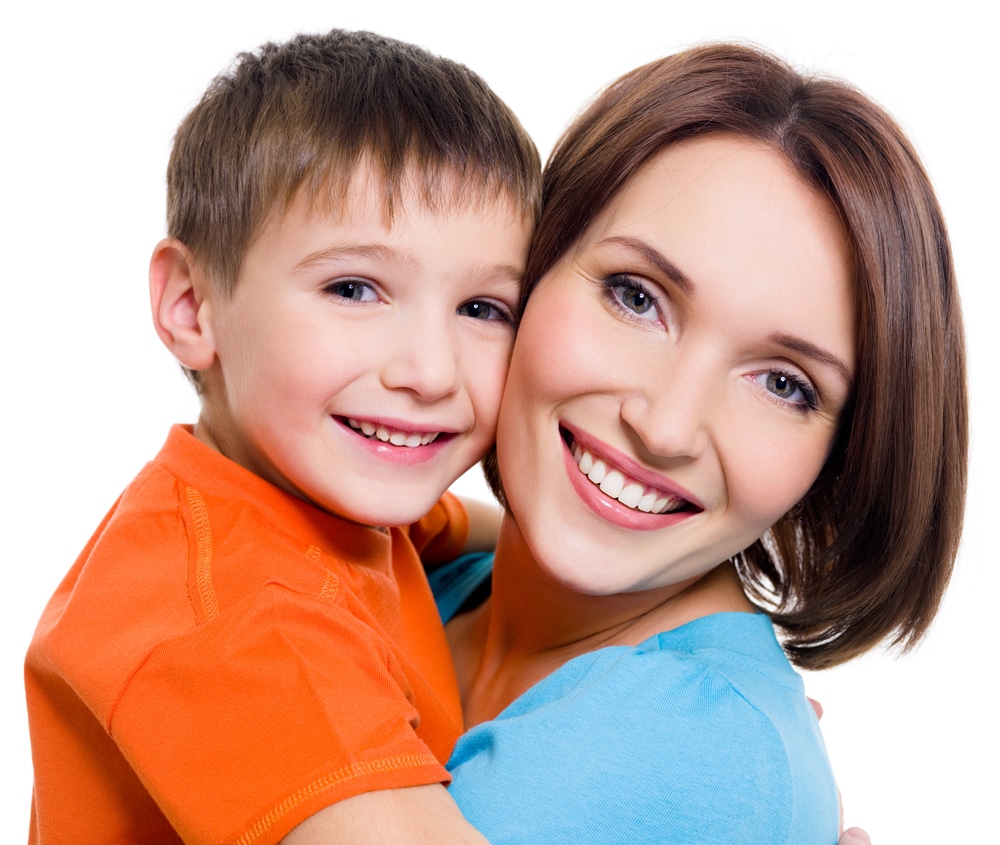 Mother holds young child who no longer deals with frequent ear infections.